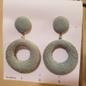 Sage green suede earrings.